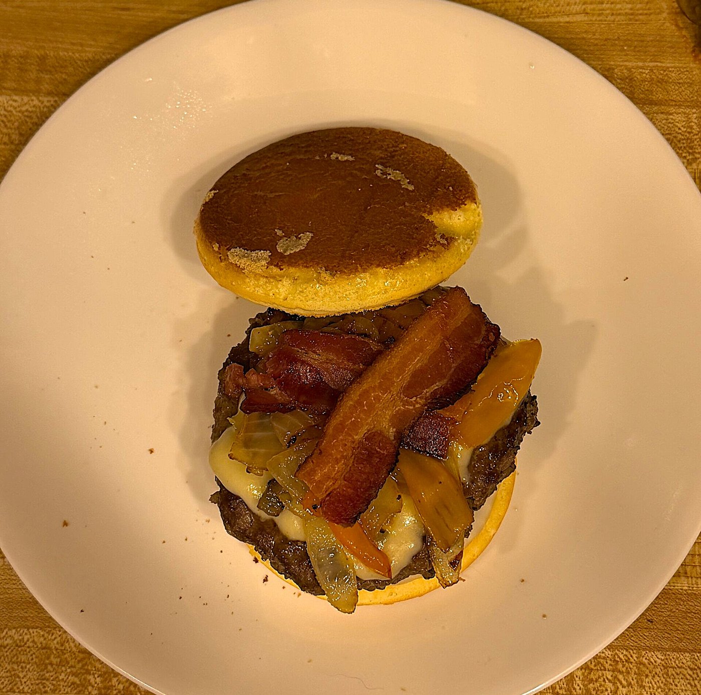 Overhead view of the carnivore-adjacent burger open-faced on a plate before closing